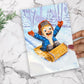 Boy playing with snow sled Boy playing with snow sled poster print Wall Art Sttelland Boutique